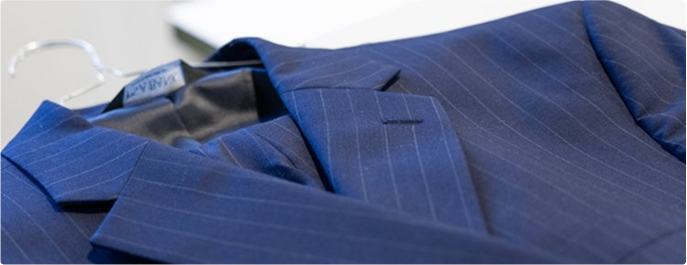 Tailored blazer with sleek lapels and button details.