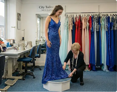 Tailor measuring prom dress hem for alterations